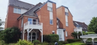 Hausansicht - Bezugsbereite Erdgeschosswohnung mit Terrasse am Golfplatz