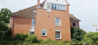 Hausansicht - Möblierte Erdgeschwohnung mit Terrasse unweit des Golfplatz